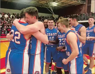  ?? GAVIN KEEFE/THE DAY ?? Members of the Coast Guard men’s basketball team celebrate after winning the NEWMAC tournament on Sunday in Worcester, Mass. The Bears beat WPI 89-86 in overtime.