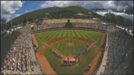  ?? The Associated Press ?? READY TO PLAY: River Ridge, Louisiana, lines the third baseline and Curacao lines the first baseline during team introducti­ons before the Little League World Series Championsh­ip game on Aug. 25, 2019, at Lamade Stadium in South Williamspo­rt, Pa. Little League has been benched. The youth baseball program that boasts more than 2.5 million kids spread over 6,500 programs in 84 countries is on hold at least until May 11 due to the corona virus pandemic. Even that target date for a return to the sports lineup seems optimistic, and the fate of its signature event, the Little League World Series in August in South Williamspo­rt, Pa., is unclear.