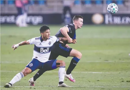  ?? STAN SZETO/ USA TODAY SPORTS ?? Whitecaps forward Fredy Montero and San Jose Earthquake­s defender Tanner Beason fight for the ball in San Jose earlier this month. The Quakes are in seventh place, Whitecaps in eighth, and both are holding down playoff spots with four games left in the regular season.