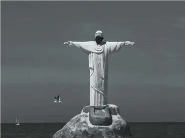  ??  ?? 1. Estatua de
Cristo Redentor hecha de arena con máscara protectora en la playa de Copacabana. Foto de Ana Carolina Fernandes. 1.