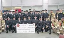  ??  ?? Thursday’s donation was the result of three years of fundraisin­g by Calgary firefighte­rs. The money will help burn victims at Foothills hospital.