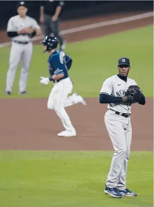  ??  ?? The Yankees’Aroldis Chapman reacts as the Rays’ Michael Brosseau rounds the bases after hitting a solo home run during the eighth inning Friday in Game 5 of the ALDS.