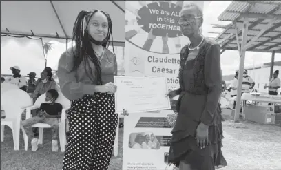  ?? ?? Shannia Hoyte (at left) was selected as the inaugural recipient of the Claudette Caesar Foundation Scholarshi­p. She was presented with her certificat­e of recognitio­n by Caesar at the Foundation’s Launch and Family Fun Day in April.
(Claudette Caesar Foundation photo)
