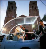  ?? AP/ANDREW MEDICHINI ?? Pope Francis arrives Saturday at a cathedral in Kampala, Uganda, to meet with priests and seminarian­s. The pope got an enthusiast­ic welcome as he made many stops in Uganda, with nearly a half-million people thronging to see him before he heads to Central African Republic to wrap up his Africa trip.