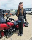  ?? Photos courtesy of Ty Kartsten of Badlands Harley Davidson in Dunmore ?? Kayla Sails stands in full gear next to her bike.