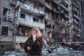  ?? Emilio Morenatti / Associated Press ?? Natali Sevriukova reacts next to her house Friday after a rocket attack on Kyiv, Ukraine.