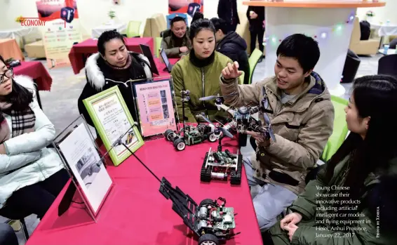  ??  ?? Young Chinese showcase their innovative products including artificial intelligen­t car models and flying equipment in Hefei, Anhui Province, January 22, 2017