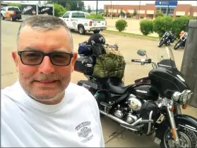  ?? Courtesy photo ?? traveling 10,000 miles through 27 states in 12 days. Not only did he complete the challenge, he finished in the top 20 among 130 riders. Here, McLeod stands next to his 2013 Harley-Davidson motorcycle.