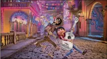  ?? CONTRIBUTE­D BYWALT DISNEY PICTURES-PIXAR ANIMATION STUDIOST ?? In “Coco,” Miguel’s love ofmusic ultimately leads him to the Land of the Dead, where he teams upwith charming trickster Hector.