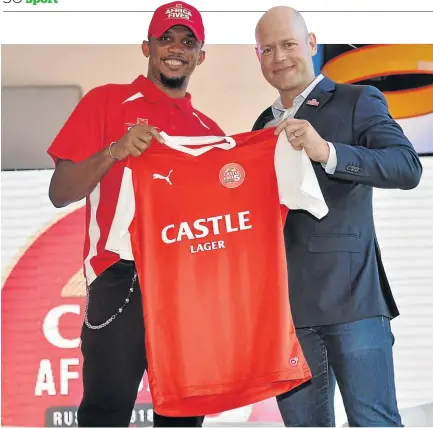 ?? / LEFTY SHIVAMBU/GALLO IMAGES ?? Cameroon superstar Samuel Eto’o, left, is handed a shirt by Vaughan Croeser, Castle brand director, at yesterday’s Fives media launch in Johannesbu­rg.