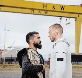  ?? THE CANADIAN PRESS ?? Canadian featherwei­ght Jeremy (JBC) Kennedy, right, squares off with Bellator champion Patricio (Pitbull) Freire in front of the famous cranes at the Harland & Wolff shipyard in Belfast, Ireland.