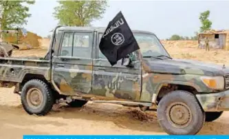  ?? — AFP ?? BAGA: A vehicle allegedly belonging to the Islamic State group in West Africa (ISWAP) is seen in Baga.