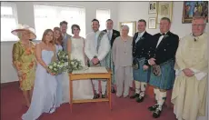  ?? 25_c13irving1­38 ?? Left to right are Yvonne’s mum Janette MacHugh, bridesmaid­s Lindsay MacDonald and Jacquelynn MacHugh, Phil MacHugh, Yvonne and Billy Irving, Colin Irving, Margaret Irving, Jamie Irving, Jim Irving and Canon Edward Cameron.