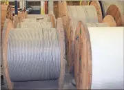  ?? Doug Walker / Rome News-Tribune ?? Huge spools of cable from the Brugg Cable plant will either be sold or scrapped by the end of the month to make way for Suhner Manufactur­ing, a sister company.