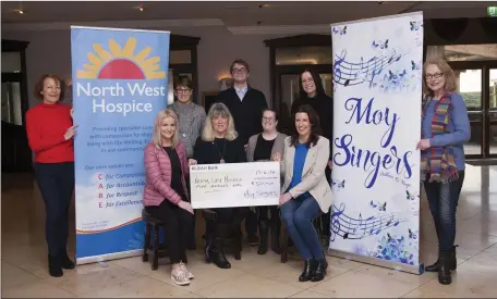 ??  ?? Following their very successful Christmas Concert, The Moy Singers made a number of donations to local charities including a the North West Hospice. Pictured below are some Enniscrone members of the choir presenting a cheque to the charity. L to R...