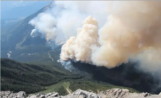  ?? PARKS CANADA ?? The Verdant Creek fire has grown substantia­lly, to at least 11,000 hectares, and has pumped considerab­le amounts of smoke to areas of Kootenay National Park.