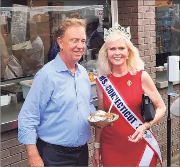  ?? Contribute­d photo ?? Gov. Ned Lamont with Debra Eccles, Ms. Connecticu­t Senior America, during one of her recent public appearance­s.