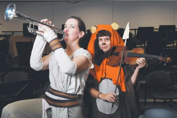  ?? Picture: KATRINA BRIDGEFORD ?? In Star Wars garb to celebrate 30 years of the Darwin Symphony Orchestra are Helen Humphreys as Rey and Tara Murphy as an ewok