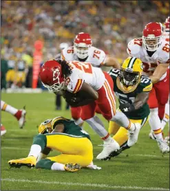  ??  ?? Kansas City Chiefs’ Jamaal Charles gets into the end zone on a run past Green Bay Packers’ Nate Palmer (51).