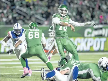  ?? THE CANADIAN PRESS FILES ?? Roughrider­s quarterbac­k Brandon Bridge throws the ball down field during a game against the Montreal Alouettes last month.