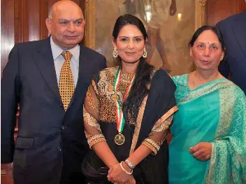  ??  ?? Protection: Priti Patel won’t see father Sushil and mother Anjana at Christmas