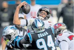  ?? Brian Blanco, The Associated Press ?? Buccaneers quarterbac­k Tom Brady is sacked by the Panthers during the second half Sunday in Charlotte, N. C.