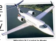  ??  ?? Winging it: Learjet in flight