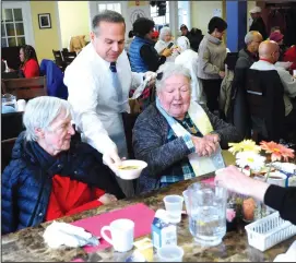  ?? Ernest A. Brown photo ?? Above, Congressma­n David Cicilline serves lunch to seniors at the Leon Mathieu Senior Center in Pawtucket following his announceme­nt, Wednesday, of the bipartisan CREATES Act that will lower prescripti­on drug prices for seniors by increasing competitio­n and making it easier for generic drugs to enter the market.