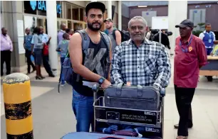  ?? Reuters ?? Ahmed Khalid with his father at Jomo Kenyatta Internatio­nal Airport in Nairobi. —
