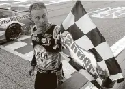  ?? Kevin C. Cox / Getty Images ?? Kevin Harvick celebrates after winning his third race at Atlanta Motor Speedway and his 51st overall.