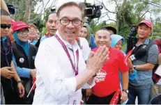  ?? — Reuters ?? Anwar Ibrahim visits a polling station during the by-election in Port Dickson.