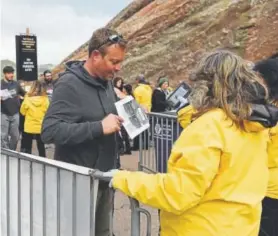  ?? Seth McConnell, Denver Post file ?? Fans have their tickets scanned before the Primus concert at Red Rocks Amphitheat­re in May 2017. In 2018, tickets purchased in the first four rows must be used by the original purchaser, officials announced.
