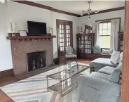  ?? ?? French doors and a large built-in grace the living room in 1805 N. Prospect Road.