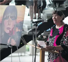  ?? KAYLE NEIS ?? Sharolyn Dickson speaks on behalf of Joni Mitchell during the unveiling of a plaque honouring the musician at River Landing on Sunday.