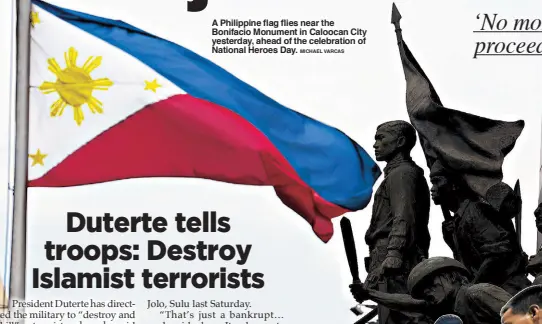  ?? MICHAEL VARCAS ?? A Philippine flag flies near the Bonifacio Monument in Caloocan City yesterday, ahead of the celebratio­n of National Heroes Day.