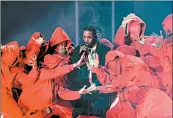  ?? TIMOTHY A. CLARY/GETTY-AFP ?? Kendrick Lamar, performing at the 2018 Grammy Awards, was nominated for eight Grammys on Friday.
