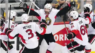  ?? GENE J. PUSKAR/THE ASSOCIATED PRESS ?? The Senators celebrateS­aturday’s 2-1 overtime win over the Penguins in Game 1 of the Eastern Conference final.