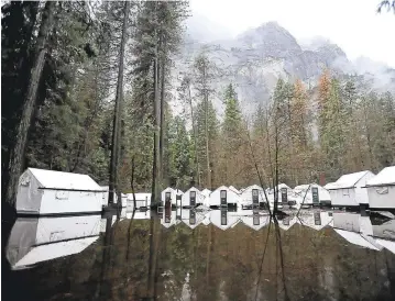  ?? PHOTOS BY SILVIA FLORES/THE FRESNO BEE ?? Tent cabins in Half Dome Village in Yosemite National Park sit in floodwater­s below Glacier Point on Jan. 9.