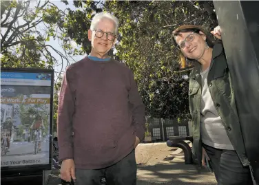 ?? Liz Hafalia / The Chronicle ?? Helen Goldsmith and Paul Heller noticed a plaque touting a time capsule buried at Sansome and Embarcader­o.