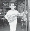  ?? SOUTH FLORIDA NEWS SERVICE/COURTESY ?? Angel Zoilo Perera, 78, plays guitar at La Esquina de La Fama restaurant on Calle Ocho in Little Havana.