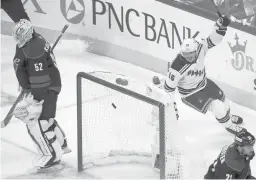  ?? CHRIS SEWARD/AP ?? Rangers center Ryan Strome (16) celebrates his goal in front of Hurricanes goaltender Pyotr Kochetkov (52) and right wing Nino Niederreit­er (21) during the second period of Game 7 a second-round playoff series Monday in Raleigh, North Carolina.