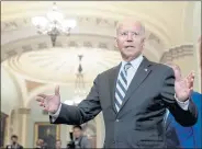  ?? ANDREW HARNIK — THE ASSOCIATED PRESS ?? President Joe Biden speaks with members of the media after leaving a meeting with Democrats at the Capitol in Washington on Wednesday to discuss the infrastruc­ture agenda.