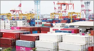  ?? (AP) ?? Containers are placed at a port in Yokohama, south of Tokyo, on June 17, 2020. Japan’s trade surplus widened in August as the pandemic pummeled a wide array of industries and sapped consumer demand, according to pre
liminary data from the Finance Ministry released on Sept 16.