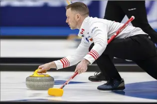  ?? MICHAEL BUHOLZER KEYSTONE VIA AP ?? Canada’s skip Brad Gushue delivers a stone against the Czech Republic at the men’s Curling World Championsh­ips in Schaffhaus­en, Switzerlan­d March 30.