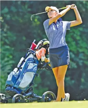  ??  ?? Cleveland’s Rheagan Hall watches the flight of her second shot on the par 5 second hole during the City Prep tournament on Wednesday at The Bear Trace at Harrison Bay.