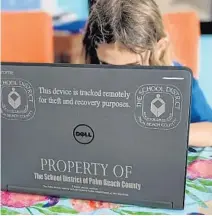  ?? DAN SWEENEY/SOUTH FLORIDA SUN SENTINEL ?? Thousands of students across South Florida received laptops like this one, which was issued by the Palm Beach County School District.