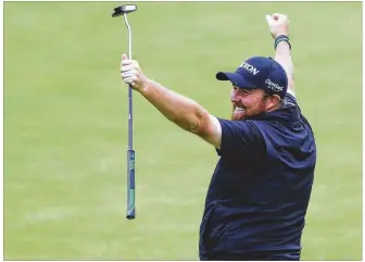  ?? KEVIN C. COX / GETTY IMAGES ?? Shane Lowry of Ireland celebrates on the 18th green Sunday during the final round of the British Open on the Dunluce Links at Royal Portrush Golf Club in Northern Ireland. Lowry, 32, shot a 1-over 72 despite the rain and no one came closer to his big lead all day than three strokes.