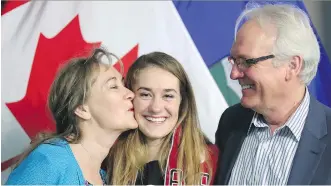  ?? LEAH HENNEL ?? Olympic ski jumper Taylor Henrich was congratula­ted by parents Kim and Steve Henrich after being announced Wednesday in Calgary as Canada’s lone female ski jumper heading to the 2018 Winter Games.