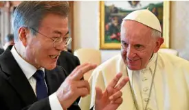  ?? —AP ?? MEETING THE POPE South Korean President Moon Jae-in, who was baptized as Timothy Moon, talks with Pope Francis during their private audience at the Vatican on Oct. 18.