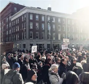  ??  ?? Hundreds of people attend a rally in support of the Affordable Care Act yesterday at Portland City Hall in Portland, Maine. Similar rallies took place around the country.